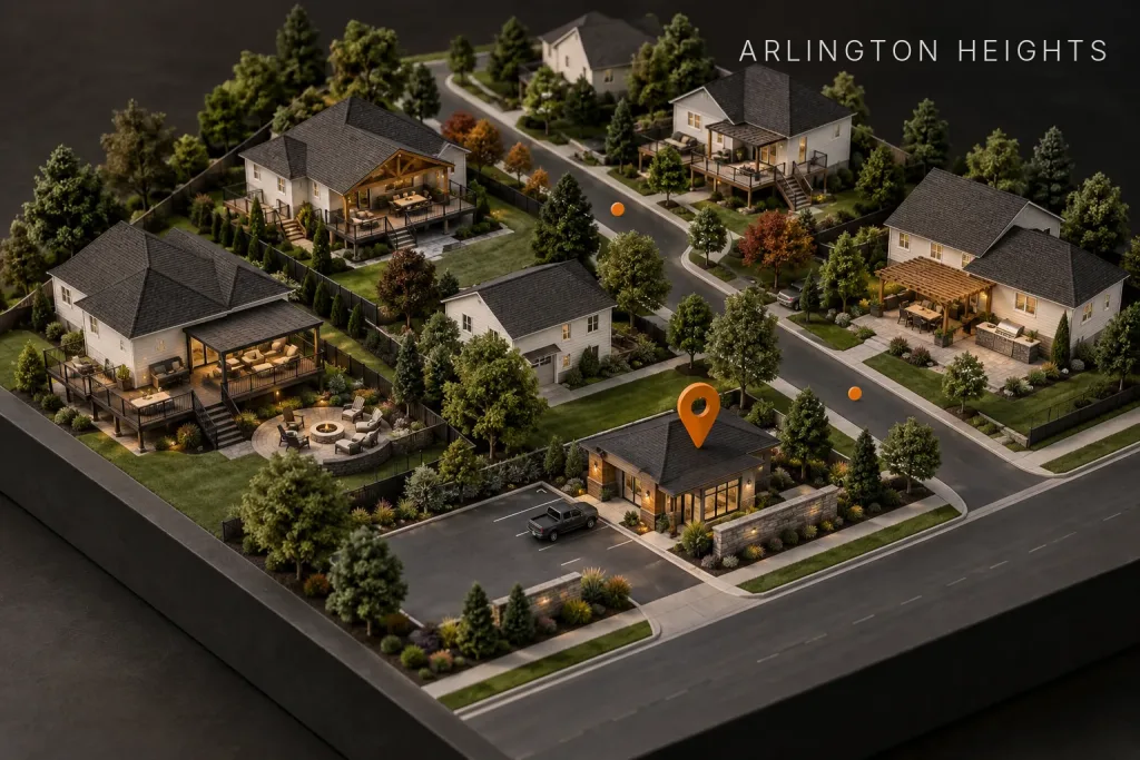 Scale model of a suburban neighborhood with decks and patios, marked by an orange map pin over a contractor's shop, labeled Arlington Heights, IL