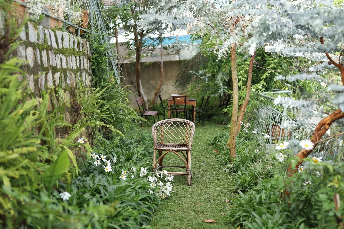 A peaceful garden path with wooden chairs, symbolizing the importance of a serene online presence for contractors.